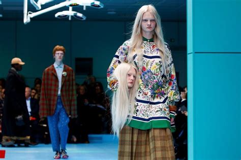 gucci models holding heads|Milan Fashion Week: Models carry fake heads on Gucci catwalk.